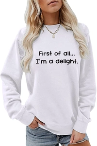 Close-up of First of all text print on white long sleeve crewneck sweatshirt for women
