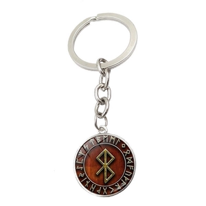 Détail du porte-clés Viking Runes avec symbole doré sur métal argenté et bois