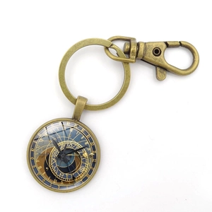 Vintage bronze keychain featuring Prague Astronomical Clock design under glass dome