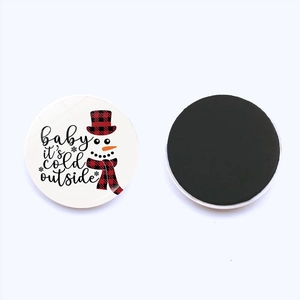 Christmas snowman magnet with red plaid patterns and 'baby it's cold outside' text