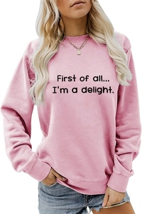 Detail of pink crewneck sweatshirt featuring First of all letter print and ribbed cuffs