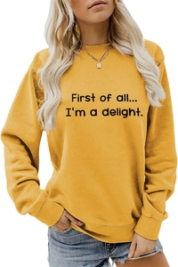 Detail of First of all... I'm a delight. slogan on ginger yellow crewneck sweatshirt
