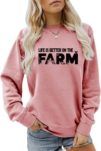 Detail of pink long sleeve farm themed sweatshirt with Life Is Better On The Farm print