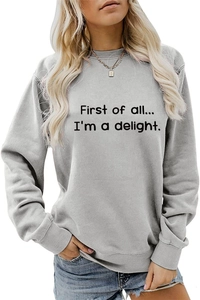 Detailed close-up of ribbed crewneck and black letter print on light grey cotton sweatshirt