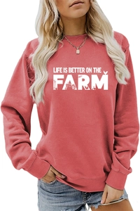 Detail of Life is Better on the Farm print on coral red long sleeve sweatshirt