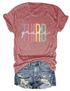 Flat lay of a red Third Grade graphic tee paired with distressed denim shorts