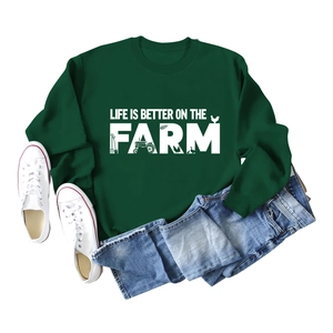 Detail of forest green sweatshirt featuring a white farm life graphic print and ribbing