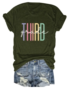 Detail of THIRD grade colorful print on green T-shirt and ripped denim shorts set