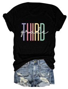 Flat lay detail of black T-shirt with Third Grade letter print and ripped denim shorts