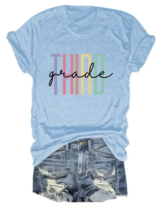Detailed flat lay of blue T-shirt with THIRD grade print and distressed denim shorts