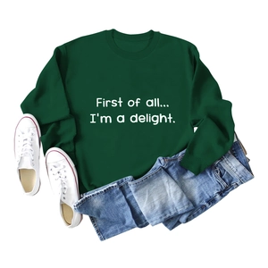Detailed flat lay of dark green sweatshirt with white First of All letter printing