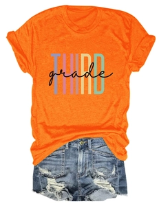 Detailed flat lay of orange Third Grade print t-shirt and distressed denim shorts