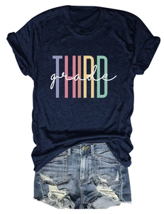 Flat lay of navy blue THIRD grade T-shirt paired with distressed denim shorts