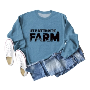 Close-up of Life Is Better On The Farm graphic print on a foggy blue sweatshirt