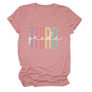 Close-up of THIRD grade colorful artistic lettering on a dusty pink cotton t-shirt
