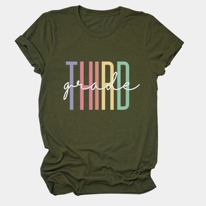 Detail of rolled sleeve cuff and colorful Third Grade print on olive green cotton t-shirt