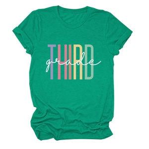 Close-up of the colorful THIRD grade text print on a casual green short sleeve T-shirt