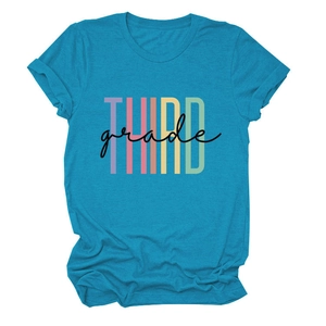 Close-up of THIRD grade colorful artistic lettering on a teal crewneck cotton t-shirt