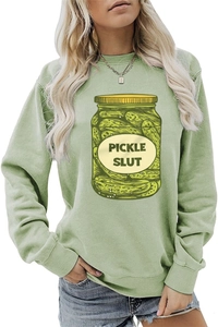 Close-up of Pickle Slut graphic print on a light green long sleeve casual sweatshirt