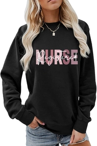 Close-up of pink Nurse Registered lettering printed on a black long-sleeved sweatshirt