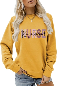 Detail of NURSE REGISTERED graphic print on mustard yellow crewneck sweatshirt