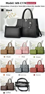 Detail view of large stone texture tote bag with nested purse and metallic V hardware