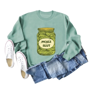 Sage green sweatshirt with Pickle Slut vintage jar graphic shown with flat lay styling