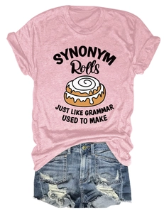 Flat lay of pink synonym rolls graphic T-shirt and ripped blue denim shorts