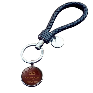 Keep Calm and Read On keychain with black braided leather strap and glass pendant charm