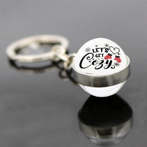 Christmas party keychain featuring double-sided glass ball with Let's Get Cozy holiday theme