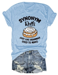 Close-up of printed t-shirt and distressed denim shorts with ripped details