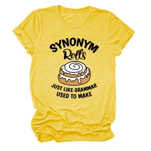 Detail of heathered yellow T-shirt showing cinnamon roll print and soft cotton texture