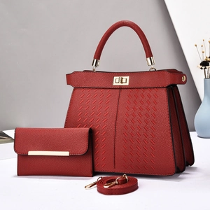 Detailed set of red lychee grain leather handbag with woven texture and metal twist lock