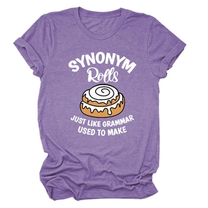 Close-up of funny cinnamon rolls print on purple cotton t-shirt with catchy quote