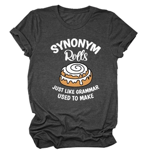 Detail of charcoal grey t-shirt featuring a cinnamon roll graphic and artistic text design