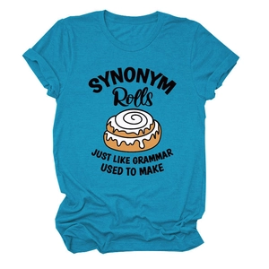 Close-up of the cinnamon roll graphic and humorous pun text on the blue cotton t-shirt