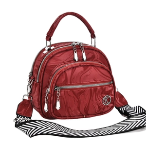 Wine red crossbody handbag with marble texture, three zipper compartments and wide strap