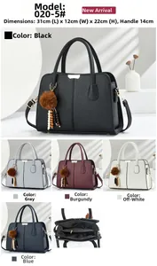 Detailed view of large capacity tote bag with dimensions 31x12x22cm and fuzzy ball charm