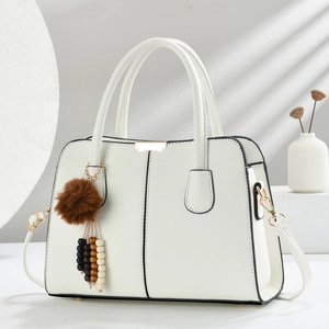 Chic beige crossbody bag with cross-grain texture and faux fur pompom charm
