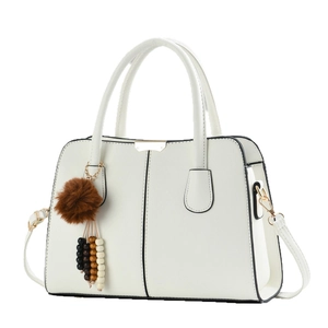 Elegant beige women's handbag with black trim, double handles and stylish charm