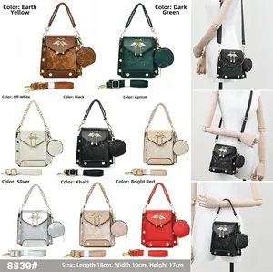 Detail view of stylish crossbody bag in 8 colors with detachable round coin purse