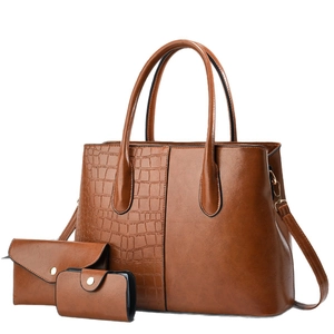 Three-piece brown tote bag set with crocodile texture and smooth faux leather finish