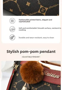 Detail view of printed faux leather handbag with fur ball charm and star pattern