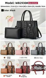 Detail view of tote bag set with heart pendant and internal storage compartments