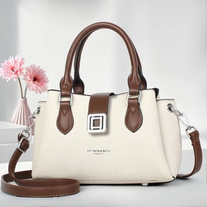 Elegant two-tone beige and brown tote bag with leather texture and top handle