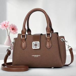 Brown leather tote bag for women with dual handles and adjustable shoulder strap