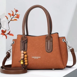 Brown orange litchi grain leather handbag for women with ethnic style wooden bead charm