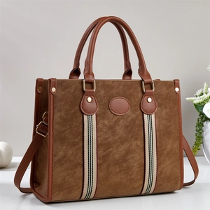 Brown vintage faux leather tote bag with stylish striped ribbon and top handles