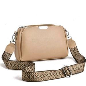 Chic beige pebbled leather crossbody bag with ethnic style patterned wide strap