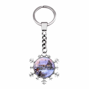 Silver snowflake keychain featuring a vintage winter cabin glass dome pendant accessory